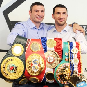 Ukrainian heavyweight boxers Wladimir Klitschko (R) and his brother Vitali Klitschko (L) pose with title belts during a press conference in Moscow, on July 8, 2011.  Wladimir and his fellow heavyweight champion elder brother, Vitali, arrived on July 8 in Moscow shortly after Wladimir's victory over Britain's Haye meaning the family now holds all four of the major world titles in professional heavyweight boxing. AFP PHOTO / NATALIA KOLESNIKOVA (Photo credit should read NATALIA KOLESNIKOVA/AFP/Getty Images)