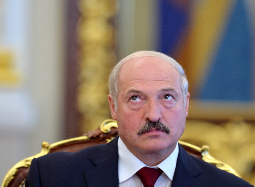 Belarussian President Alexander Lukashenko reacts on June 18, 2013 during his meeting with his Ukrainian counterpart in Kiev. Lukashenko started a two-day, official visit to Ukraine. AFP PHOTO/ SERGEI SUPINSKY