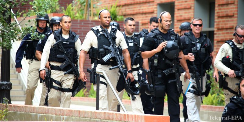 epa05341040 Law enforcement officers leave the area near an engineering building where a shooting  was reported  on the University of California at Los Angeles campus  in  Los Angeles, California,  USA, 01 June 2016.  Latest reports indicated two people were killed and law enforcement is treating the incident as a murder-suicide situation.  EPA/MIKE NELSON
