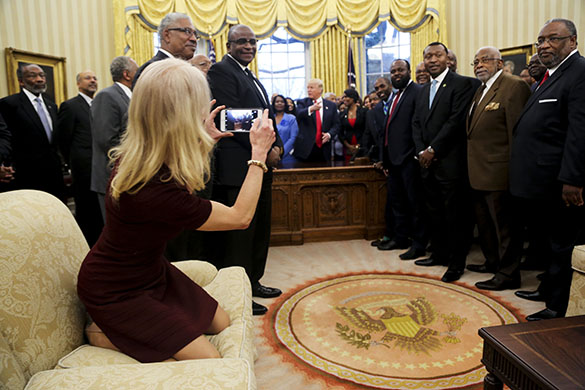 Counselor to the President Kellyanne Conway takes a picture of United States President Donald Trump with members of the Historically Black Colleges and Universities in the Oval Office of the White House, Washington, DC, February 27, 2017. Photo Credit: Aude Guerrucci/CNP/AdMedia