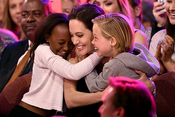 INGLEWOOD, CA - MARCH 28:  Actress Angelina Jolie hugs Zahara Marley Jolie-Pitt (L) and Shiloh Nouvel Jolie-Pitt (R) after winning award for Favorite Villain in 'Maleficent' during Nickelodeon's 28th Annual Kids' Choice Awards held at The Forum on March 28, 2015 in Inglewood, California.  (Photo by Kevin Winter/Getty Images)